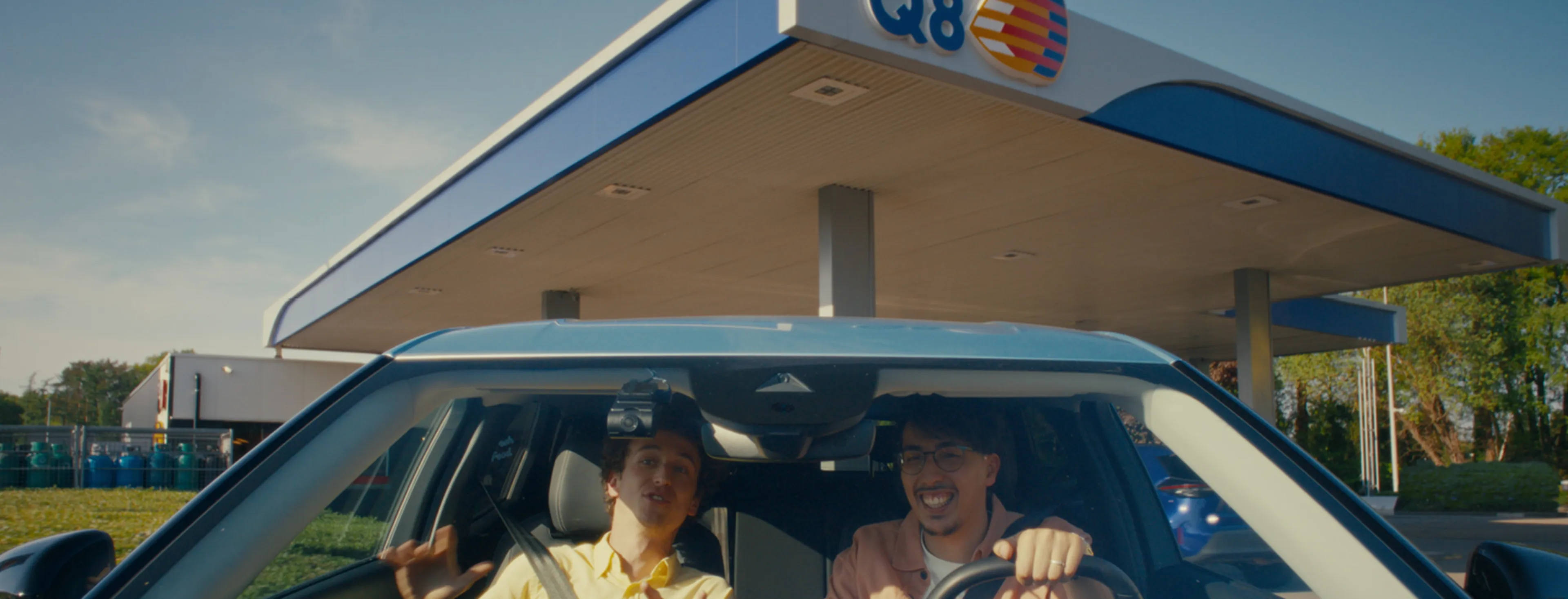 Des clients Q8 satisfaits dans la voiture